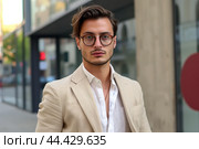 Elegant Man wearing glowing beige suit. Generate ai. Стоковое AI-изображение, AI-художник Иван Рябоконь / Фотобанк Лори