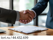 Professional handshake over business documents. Стоковое AI-изображение, AI-художник Иван Рябоконь / Фотобанк Лори
