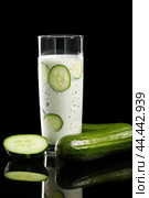 Glass of milk with fresh cucumber. Стоковое AI-изображение, AI-художник Veniamin Kraskov / Фотобанк Лори