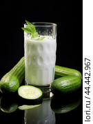 Glass of milk with fresh cucumber. Стоковое AI-изображение, AI-художник Veniamin Kraskov / Фотобанк Лори