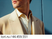 Serene Man wearing glowing beige suit. Generate ai. Стоковое AI-изображение, AI-художник Иван Рябоконь / Фотобанк Лори