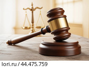 A judge's hammer with scales in the background. Стоковое AI-изображение, AI-художник RamA / Фотобанк Лори
