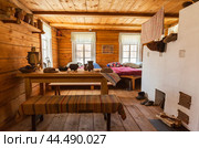 TALTSY VILLAGE, IRKUTSK REGION, RUSSIA - August 22, 2024: Architectural and Ethnographic museum Taltsy. Typical interior of Siberian wooden house of 18th c, exposition Postoyal Dvor, tavern or inn. Редакционное фото, фотограф Виктория Катьянова / Фотобанк Лори