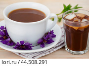 Healing drinks. Chicory drink. Cup of chicory drink and flowers on a white table. Стоковое AI-изображение, AI-художник Ирина Старикова / Фотобанк Лори