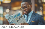 A successful businessman immersed himself in reading a business newspaper in the office. Стоковое AI-видео, аниматор Юрий Поздников / Фотобанк Лори