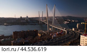 The bridge over the Golden Horn in Vladivostok, captured at sunset. Мост через бухту Золотой рог во Владивостоке, снятый на закате. Стоковое видео, видеограф Валерий Тесаков / Фотобанк Лори