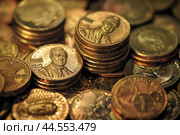 Stacks of us coins on a shiny surface. Стоковое AI-изображение, AI-художник Иван Рябоконь / Фотобанк Лори