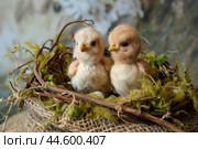 Adorable toy chicks in nest. Стоковое AI-изображение, AI-художник Иван Рябоконь / Фотобанк Лори