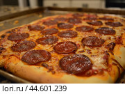Freshly baked pepperoni pizza closeup. Стоковое AI-изображение, AI-художник Иван Рябоконь / Фотобанк Лори