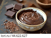 Decadent melted chocolate with chunks on rustic table. Стоковое AI-изображение, AI-художник Иван Рябоконь / Фотобанк Лори