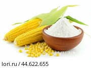 Fresh corn ears and cornflour on a white background. Стоковое AI-изображение, AI-художник Иван Рябоконь / Фотобанк Лори