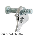 Разводной гаечный ключ на белом фоне. An adjustable wrench on a white background. Стоковое фото, фотограф Татьяна Д / Фотобанк Лори