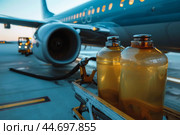 Airplane being refueled for the next flight at the airport. Стоковое AI-изображение, AI-художник Иван Рябоконь / Фотобанк Лори