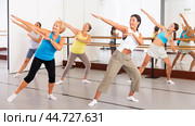 Group of active women practicing energetic dance in a studio. Стоковое фото, фотограф Яков Филимонов / Фотобанк Лори