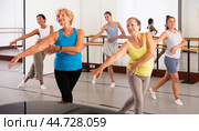Group of active women practicing energetic dance in a studio. Стоковое фото, фотограф Яков Филимонов / Фотобанк Лори