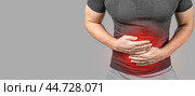 Man touching stomach, suffering painful of stomachache, gastrointestinal system desease cause of stress from work,Health insurance care concept. bowel disease concept, heartburn. copy space. Стоковое фото, фотограф Павел Муравьев / Фотобанк Лори