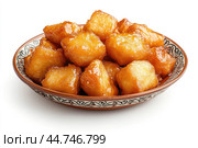 Delicious Tatar chak-chak served on a plate isolated on a white background. Стоковое AI-изображение, AI-художник Veniamin Kraskov / Фотобанк Лори