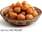 Delicious Tatar chak-chak served on a plate isolated on a white background. Стоковое AI-изображение, AI-художник Veniamin Kraskov / Фотобанк Лори