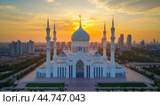 Hazrat sultan mosque shining during golden hour in astana, kazakhstan. Стоковое AI-изображение, AI-художник Юрий Поздников / Фотобанк Лори