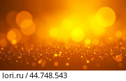 Abstract Golden Bokeh Background with Bright Center Glow, Radiant Warm Light Circles orbs, Elegant Shiny Backdrop for Luxury Design, Soft Focus Sparkle Effect for Holiday Decoration. Стоковое фото, фотограф Павел Муравьев / Фотобанк Лори