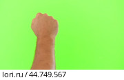 Male Hand Knocking Isolated on Chroma Key Green Screen Background. Body Language. 4K Video Footage. Close-Up. Man's Fist Making Knock Knock Gesture. Copy Space for Promotion. Greenscreen for Keying. Стоковое видео, видеограф Марина Демидюк / Фотобанк Лори