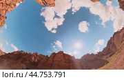The sun and sky are surrounded by canyon rocks.Kazakhstan. Charyn Canyon. 08/31/2024. Стоковое видео, видеограф Ярославский Максим / Фотобанк Лори