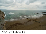 Charming Zumaia Itzurun beach. Steeply-tilted layers of flysch in Zumaia. Atlantic ocean surf in Basque Autonomous Community  in day in Bay of Biscay. View from above / top view. Стоковое фото, фотограф YuryKara / Фотобанк Лори