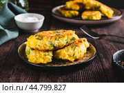 Delicious fried potato and broccoli sticks on a plate on the table. Стоковое фото, фотограф Елена Руй / Фотобанк Лори