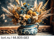 A beautiful bouquet of dried flowers in a ceramic vase on an antique wooden chest of drawers. A bouquet of flowers in a vase in a home interior. Light, beige, blue floral background. Стоковое AI-изображение, AI-художник Photojuli / Фотобанк Лори