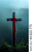 Wooden cross with red fabric in foggy background, concept of spirituality. Стоковое AI-изображение, AI-художник Анастасия Золотницкая / Фотобанк Лори