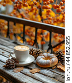 Sweet bun and morning cup of aromatic black coffee. Autumn still life. Стоковое AI-изображение, AI-художник Сергей Елизарьев / Фотобанк Лори