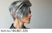 A model poses showing off an ash-colored hairstyle option. Стоковое AI-видео, аниматор Юрий Поздников / Фотобанк Лори