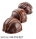 Chocolate pralines covered with milk chocolate drizzle forming line on white. Стоковое AI-изображение, AI-художник Иван Рябоконь / Фотобанк Лори