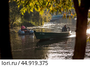 The Golden Ring of Russia,september 2024. The city of Pereslavl-Zalessky. Fishing boats on the Trubezh River at dawn. Редакционное фото, фотограф Photojuli / Фотобанк Лори