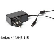 AC adapter isolated on white. Стоковое фото, фотограф Сергей Толмачёв / Фотобанк Лори