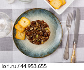 Tartare is dish of pieces of raw tuna and avocado cubes, seasoned with soy and Worcestershire sauce. Стоковое фото, фотограф Яков Филимонов / Фотобанк Лори