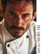 An attractive male chef, showcasing his culinary mastery and charisma. Редакционное AI-изображение, AI-художник Veniamin Kraskov / Фотобанк Лори
