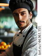 An attractive male chef, showcasing his culinary mastery and charisma. Редакционное AI-изображение, AI-художник Veniamin Kraskov / Фотобанк Лори