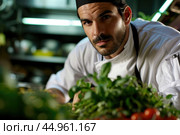 An attractive male chef, showcasing his culinary mastery and charisma. Редакционное AI-изображение, AI-художник Veniamin Kraskov / Фотобанк Лори