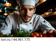An attractive male chef, showcasing his culinary mastery and charisma. Редакционное AI-изображение, AI-художник Veniamin Kraskov / Фотобанк Лори