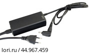 Блок питания на белом фоне. AC/DC adapter  on white background. Стоковое фото, фотограф Татьяна Д / Фотобанк Лори