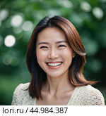 A cheerful Chinese woman dressed in a white blazer smiles warmly while standing in a vibrant lush green forest or park. Mongoloid Asian face type. AI. Стоковое AI-изображение, AI-художник Юлия Петровская / Фотобанк Лори