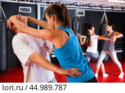 Woman practising eye gouging self-defensive move in gym. Стоковое фото, фотограф Яков Филимонов / Фотобанк Лори