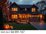 Halloween glowing decor on the facade of the house outside made of pumpkins, garlands, Jack Latern, candles. Halloween party In the evening at dusk. AI generated. Стоковое AI-изображение, AI-художник Ольга Симонова / Фотобанк Лори