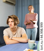 Portrait of unhappy son after discord with mother. Стоковое фото, фотограф Яков Филимонов / Фотобанк Лори