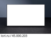 Mock up Television on gray wall in room. Watching online TV. TV 8K flat screen oled with White blank screen. TV mockup. 3d rendering. Стоковое фото, фотограф Павел Муравьев / Фотобанк Лори