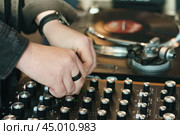 Photography of the modern premium stage mixed board / desk with vinyl turntable and vinyl plate. Close frontal view. Стоковое фото, фотограф YuryKara / Фотобанк Лори