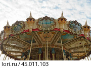 Colorful city carousel for children. Touristic concepts in Nouvelle Aquitaine. Time to get fun with children. 2019. Редакционное фото, фотограф YuryKara / Фотобанк Лори