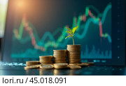 Green plant sprouting from coin stack against blurred stock market chart background symbolizing investment growth, financial success, and sustainable economy. Стоковое AI-изображение, AI-художник Павел Муравьев / Фотобанк Лори