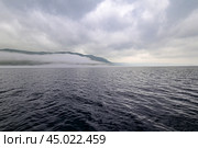 Туман над озером Байкалом. Исток Ангары. Мыс Устьянский (2024 год). Стоковое фото, фотограф Александр Тараканов / Фотобанк Лори
